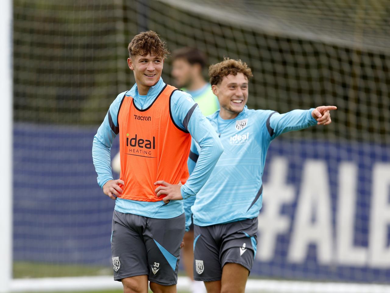 Cole Deeming and Callum Styles laughing during training 