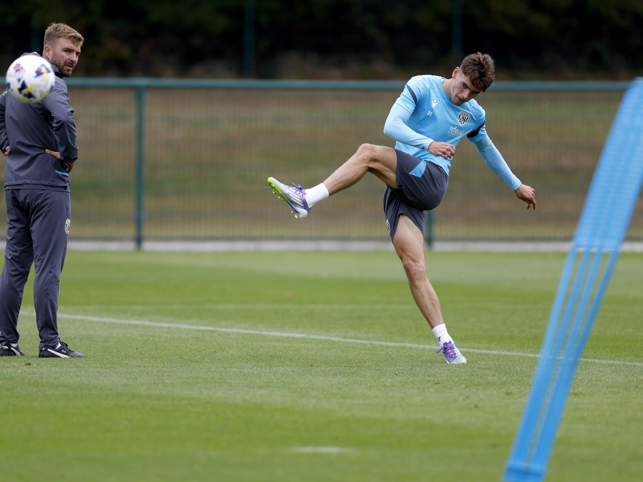 Tom Fellows striking the ball during training 