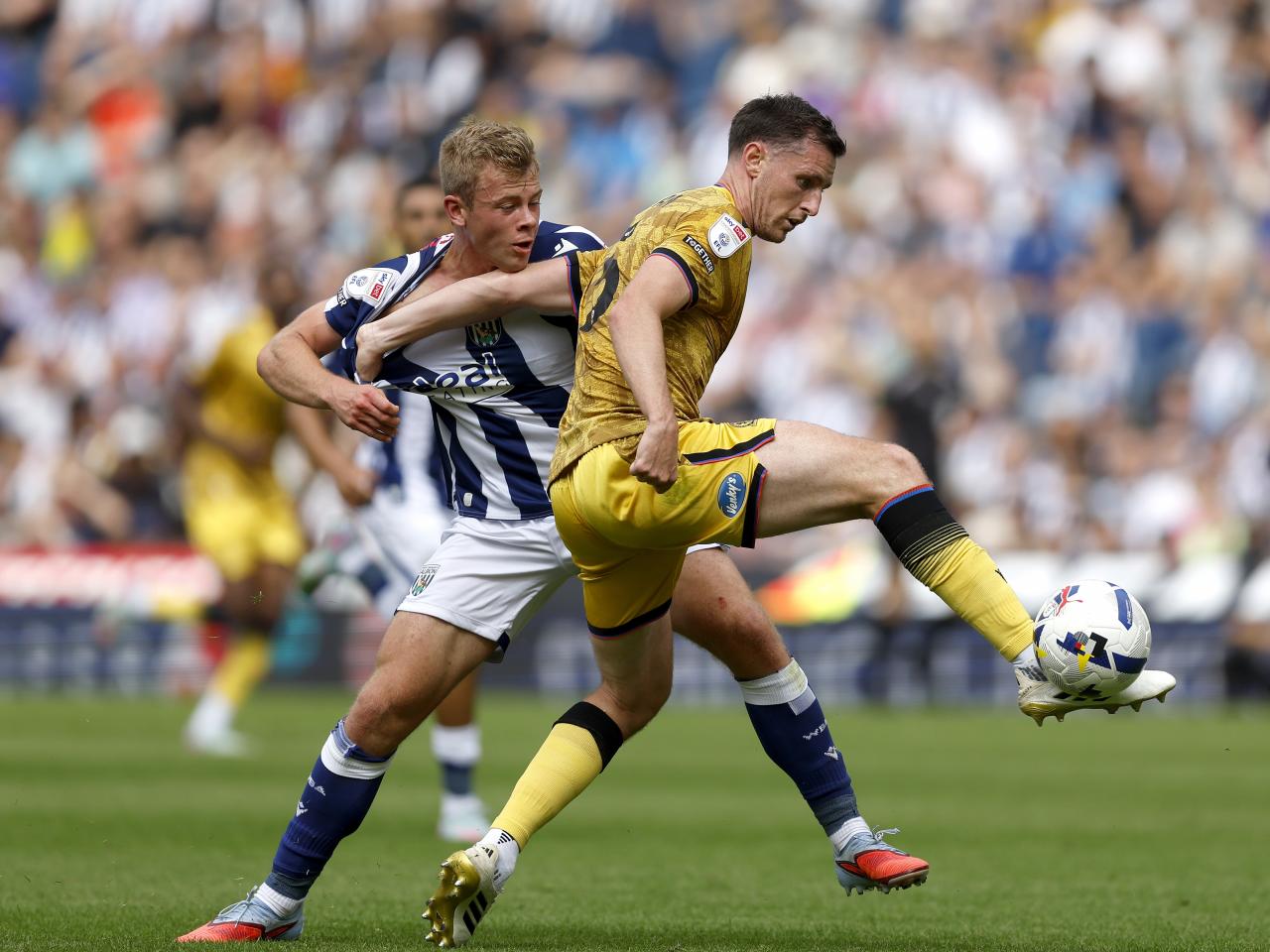 Aune Heggebø fighting for the ball with a Blackburn player