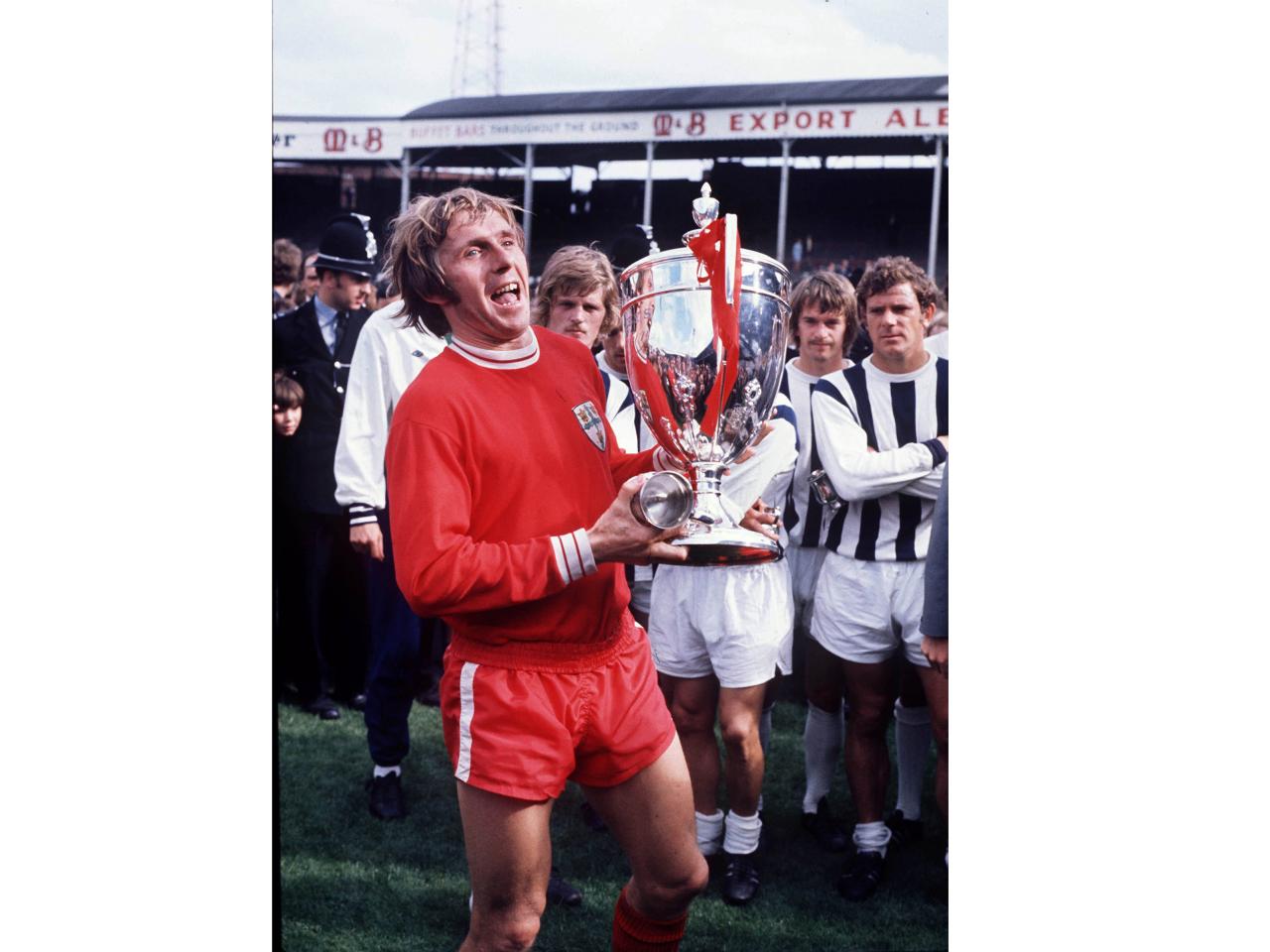 Bobby Cram lifts The wanted Cup