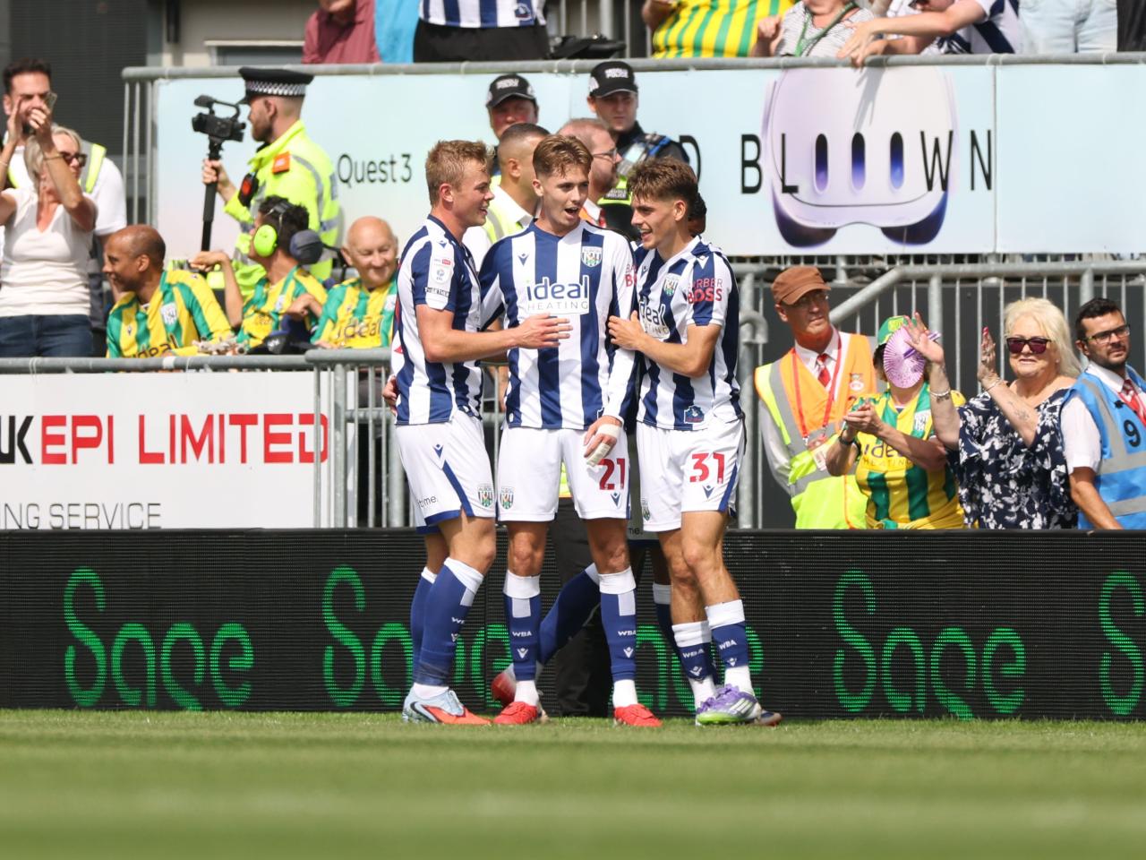Isaac Price celebrates scoring his first goal at Wrexham with team-mates