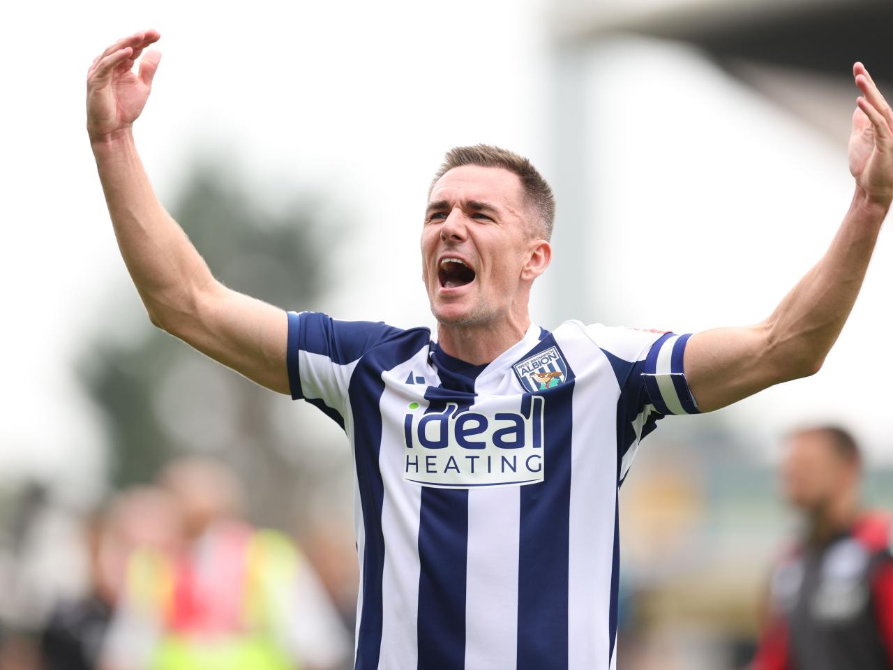 Jed Wallace celebrates at full-time after WBA beat Wrexham