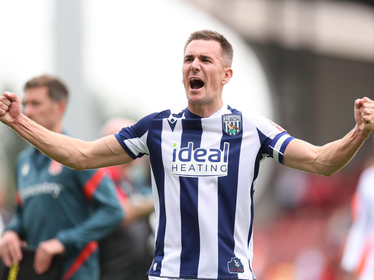 Jed Wallace celebrates at full-time after WBA beat Wrexham