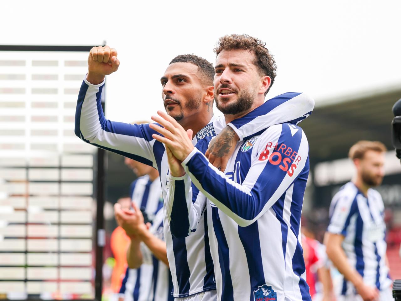 Karlan Grant and Mikey Johnston applaud WBA fans after beating Wrexham 
