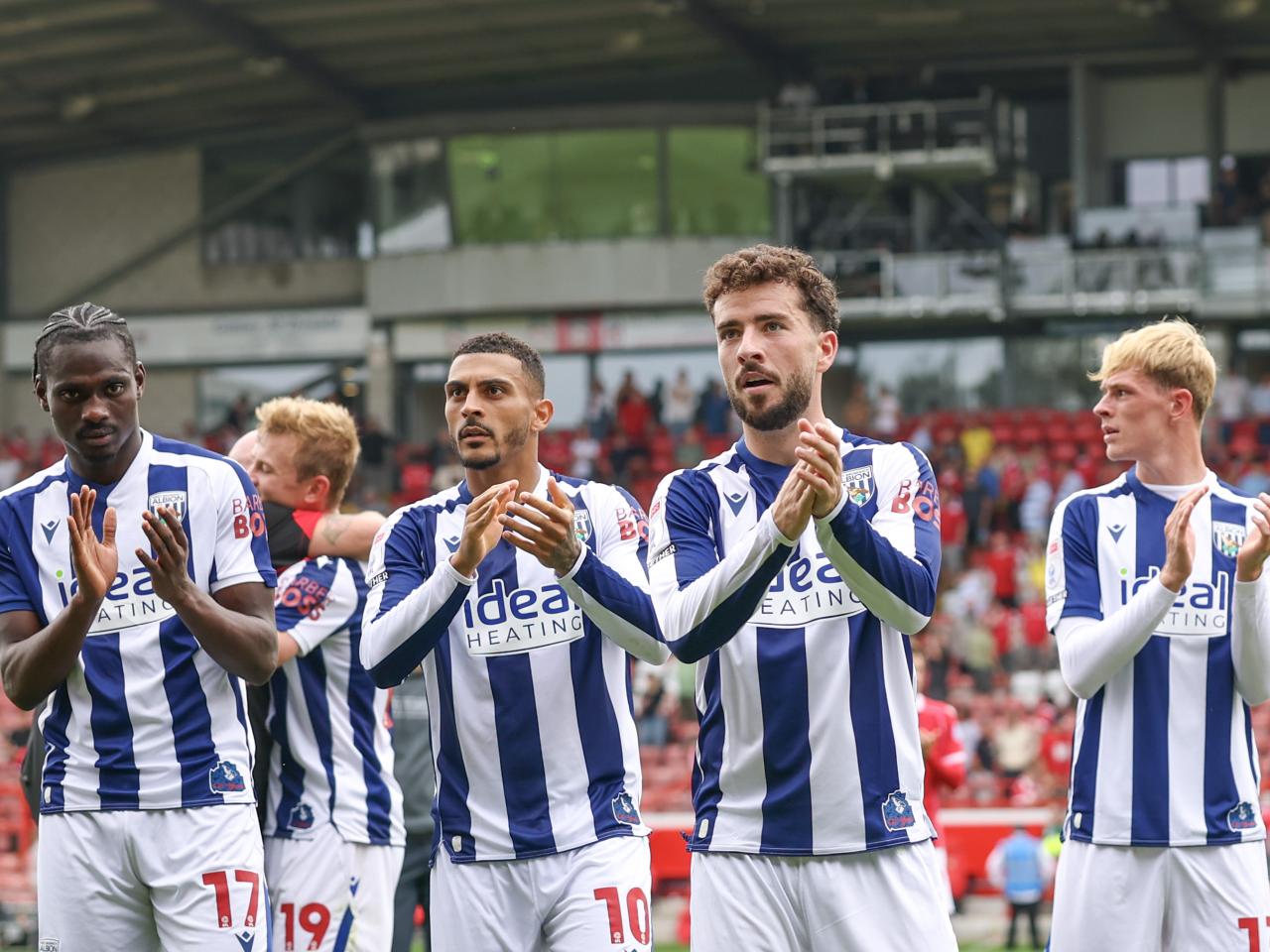 Several WBA players applaud WBA fans after beating Wrexham