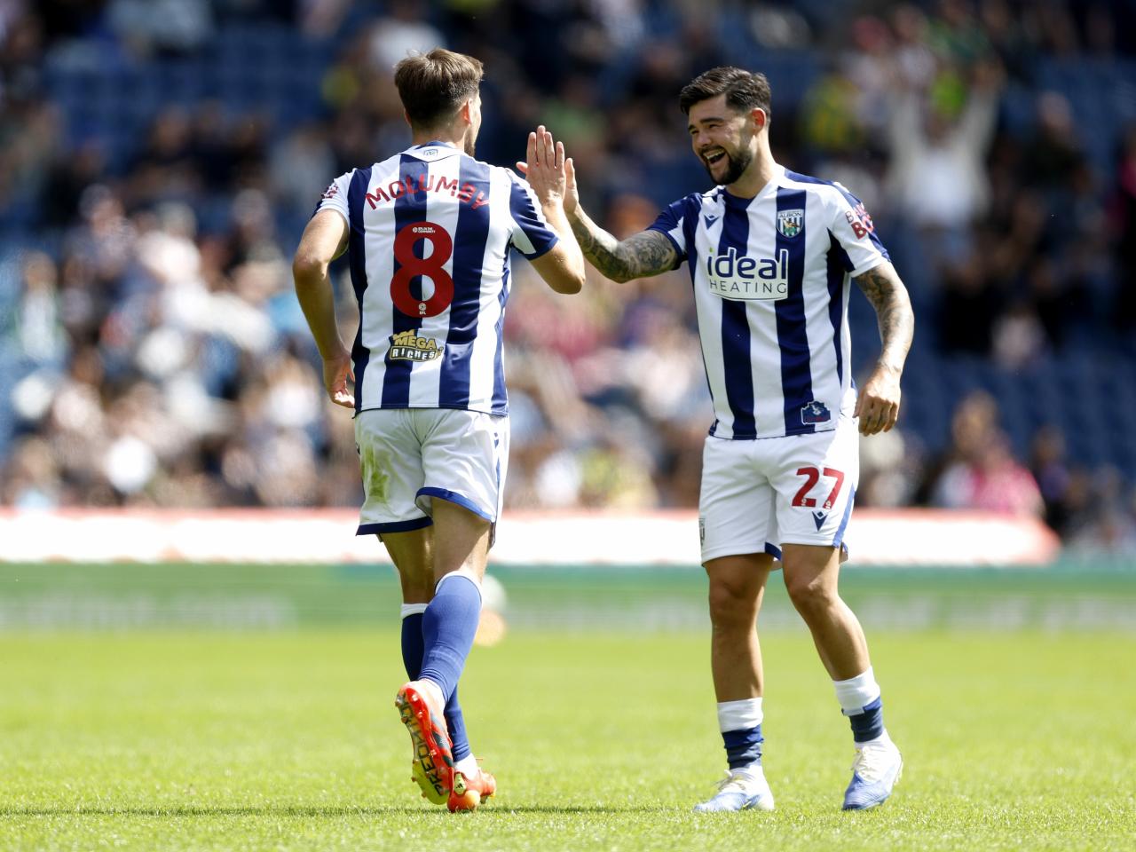 Jayson Molumby celebrates with Alex Mowatt after scoring against Rayo Vallecano