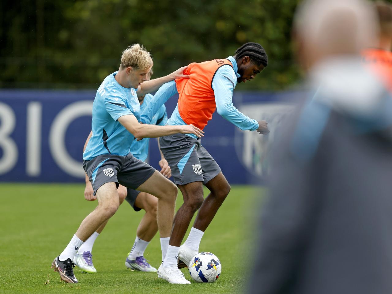 Toby Collyer and Samuel Iling-Junior fighting for the ball during training 