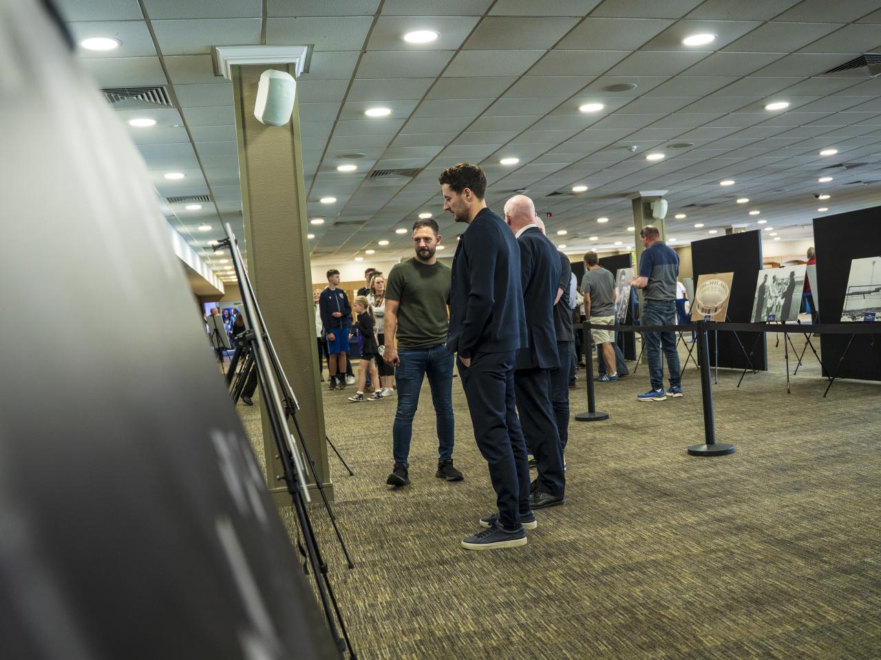 Ryan Mason walking through the East Stand looking at all the memorabilia and a specially curated gallery of 125 iconic Hawthorns images