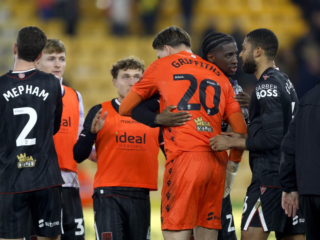 Josh Griffiths is congratulated by team-mates at full-time against Norwich 