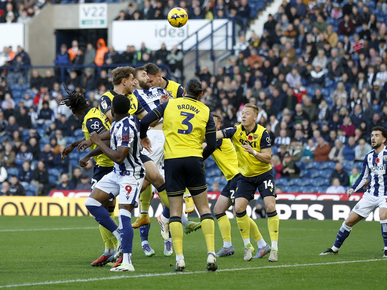 Several WBA & Oxford players jumping for the ball 
