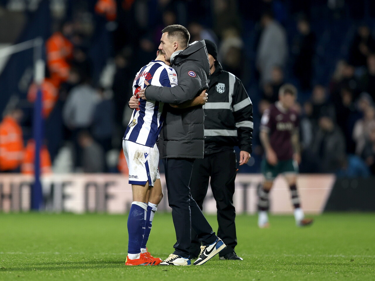 Jed Wallace hugs Jayson Molumby after the Swansea game