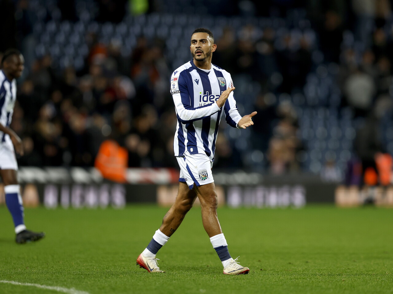 Karlan Grant applauds WBA fans after the Swansea game