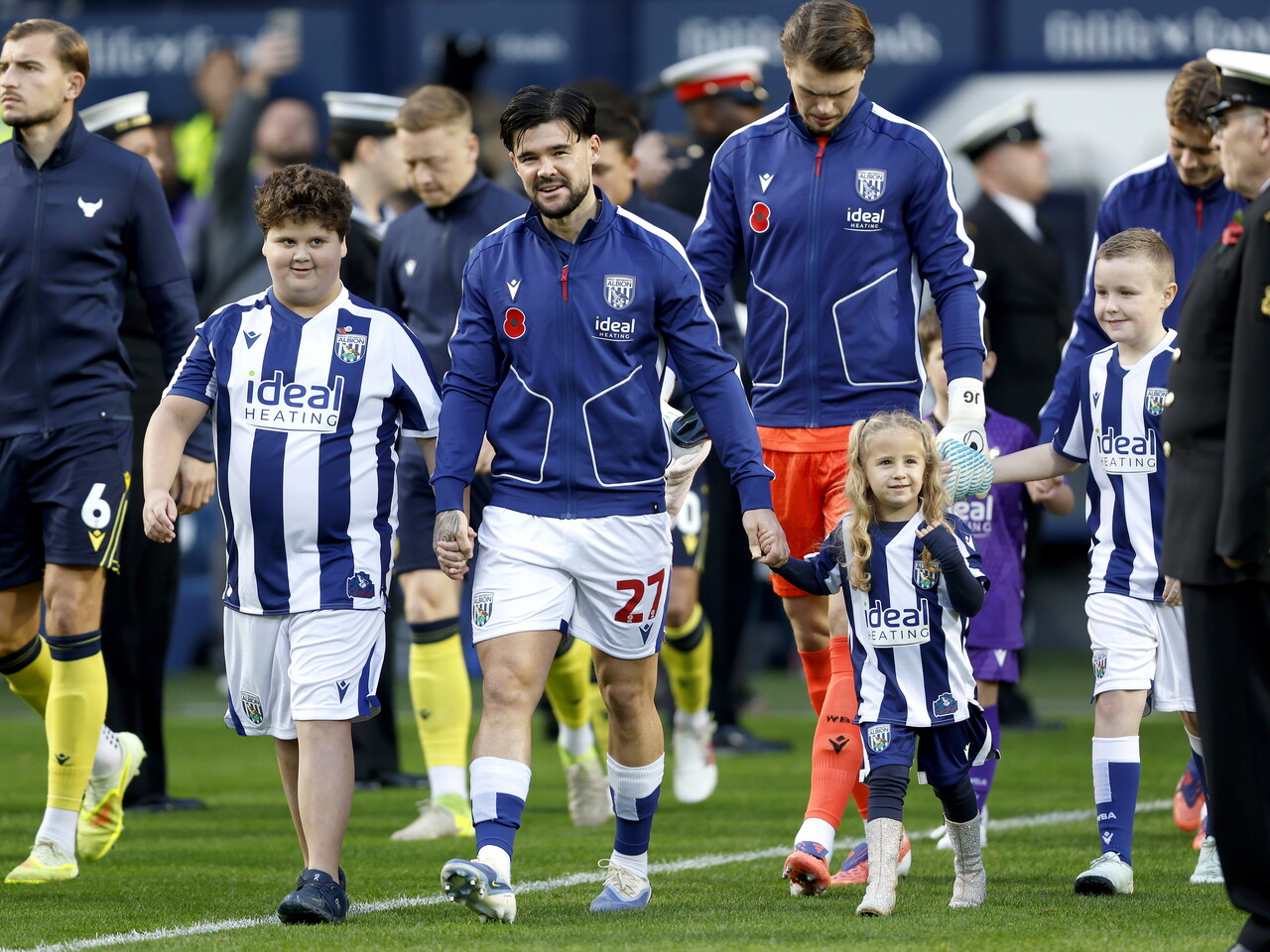 Alex Mowatt leading WBA out at The Hawthorns for the Oxford game