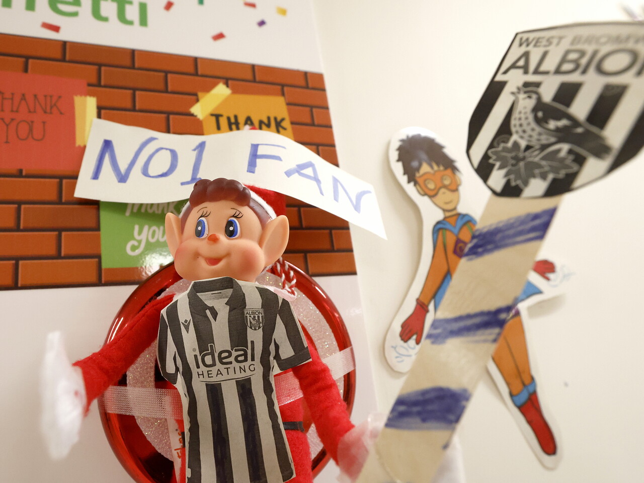 An elf with a WBA shirt on 