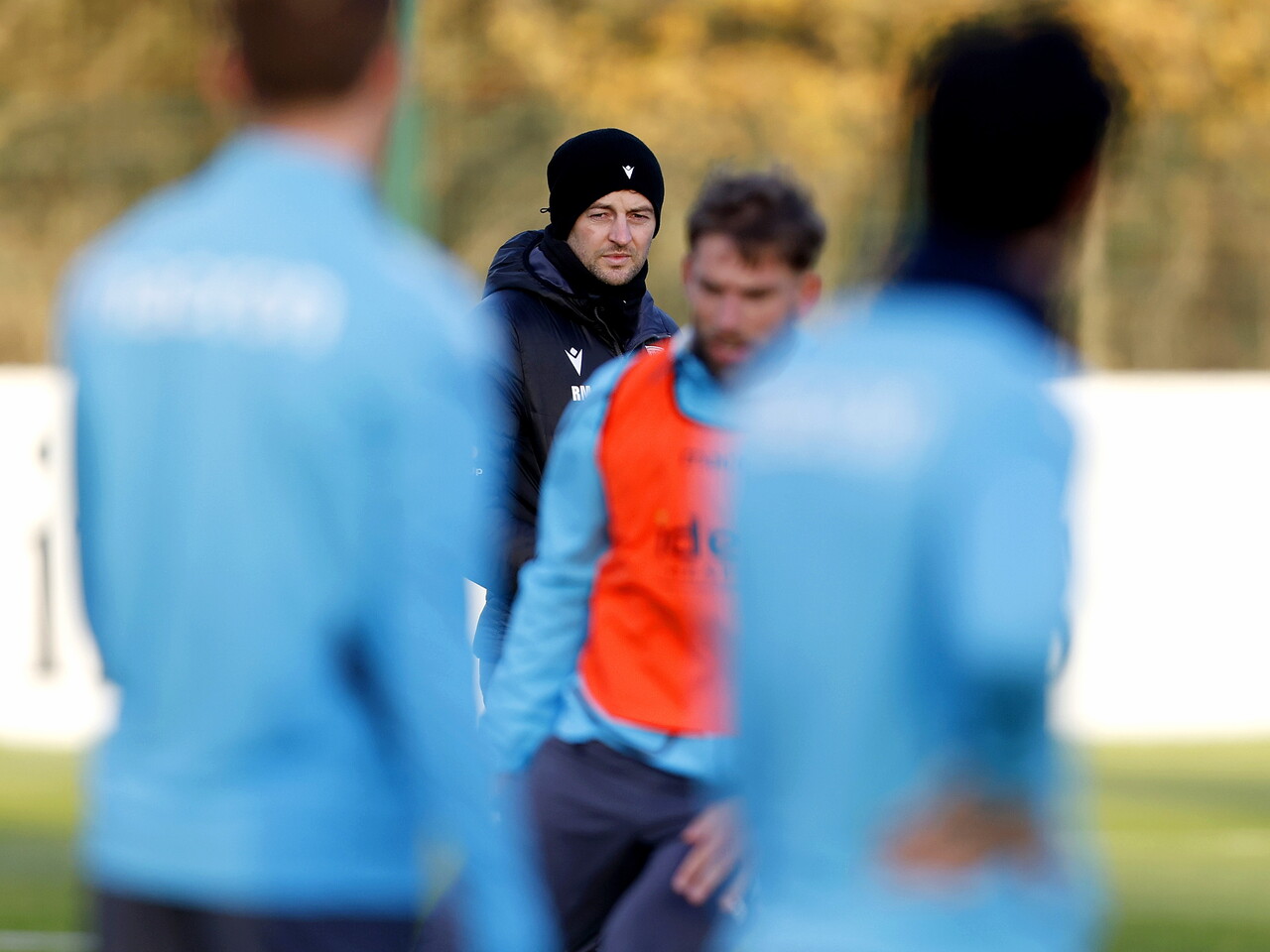 Ryan Mason watching training with a hat on
