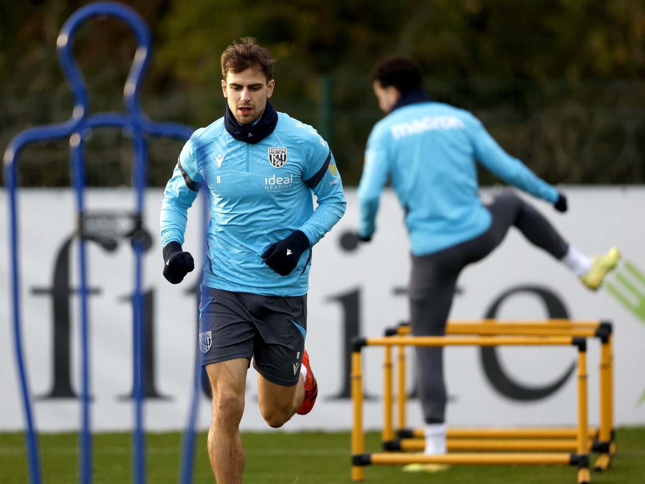 Jayson Molumby warming up before a training session