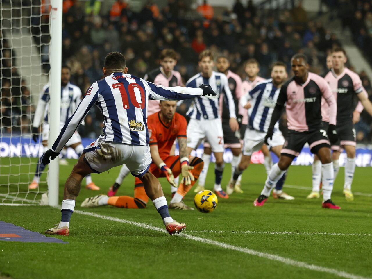 Karlan Grant fires in a cross into a crowded penalty area against QPR 