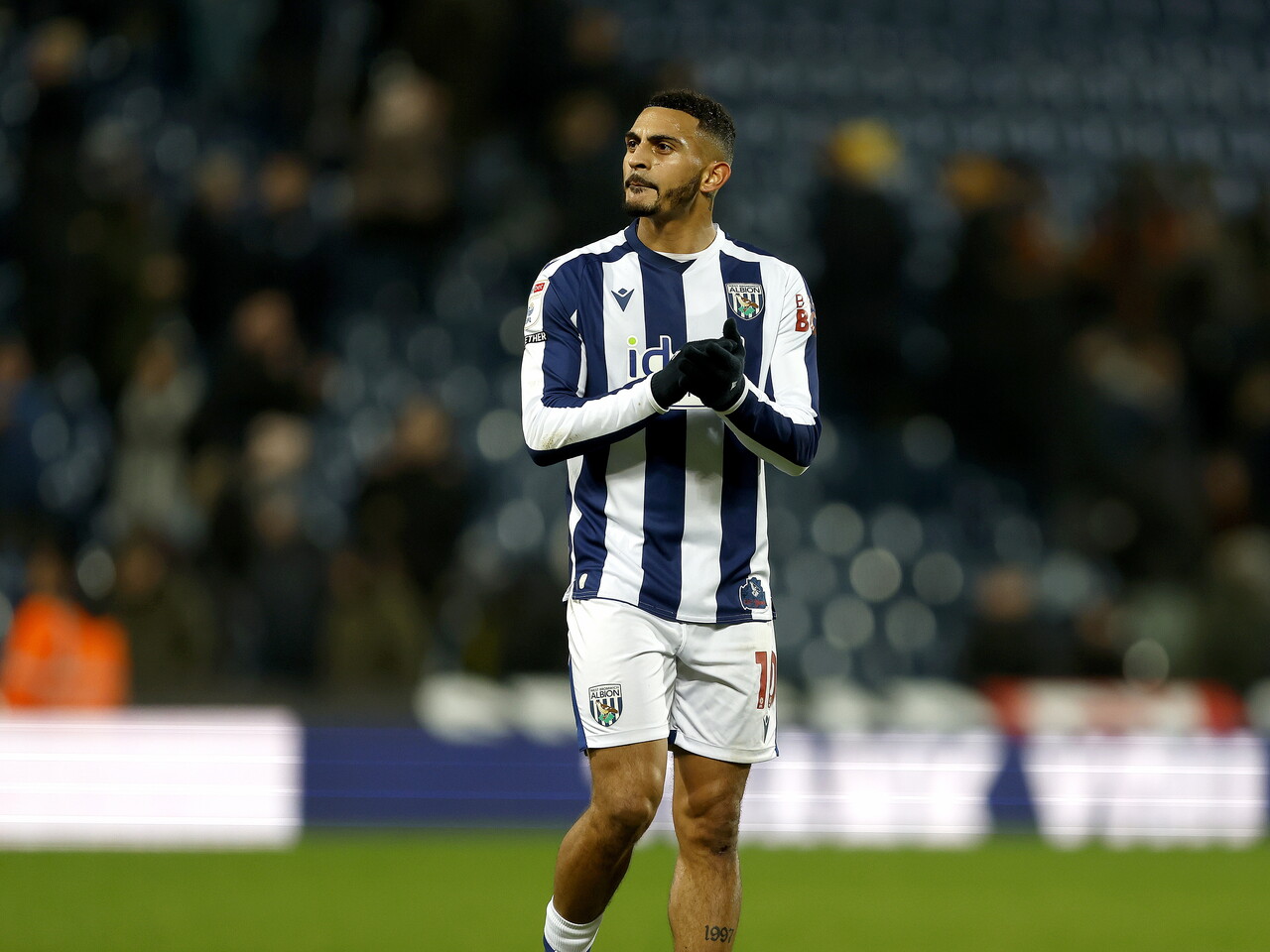 Karlan Grant applauds WBA fans after the win over QPR 