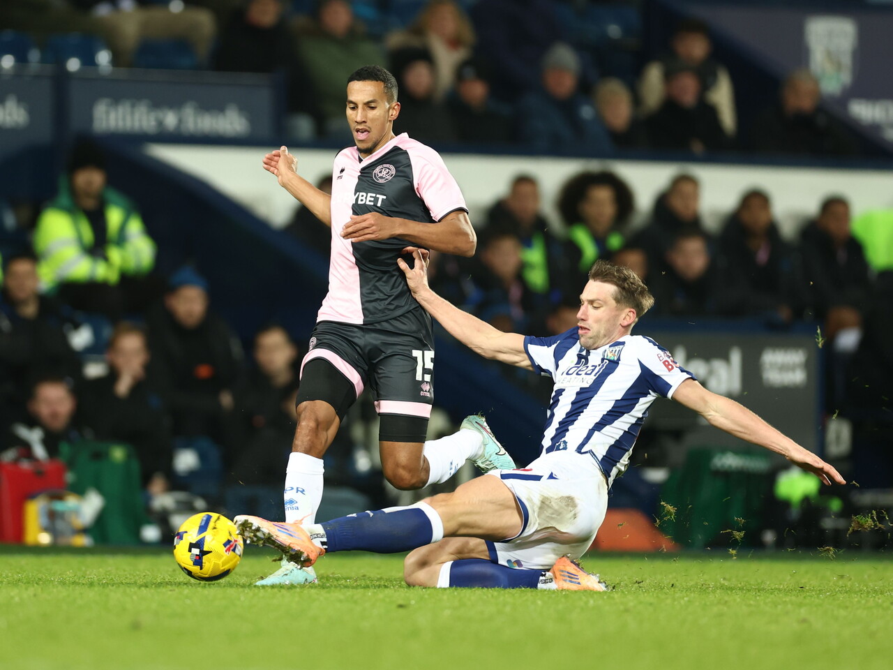 Charlie Taylor making a lunging tackle against QPR