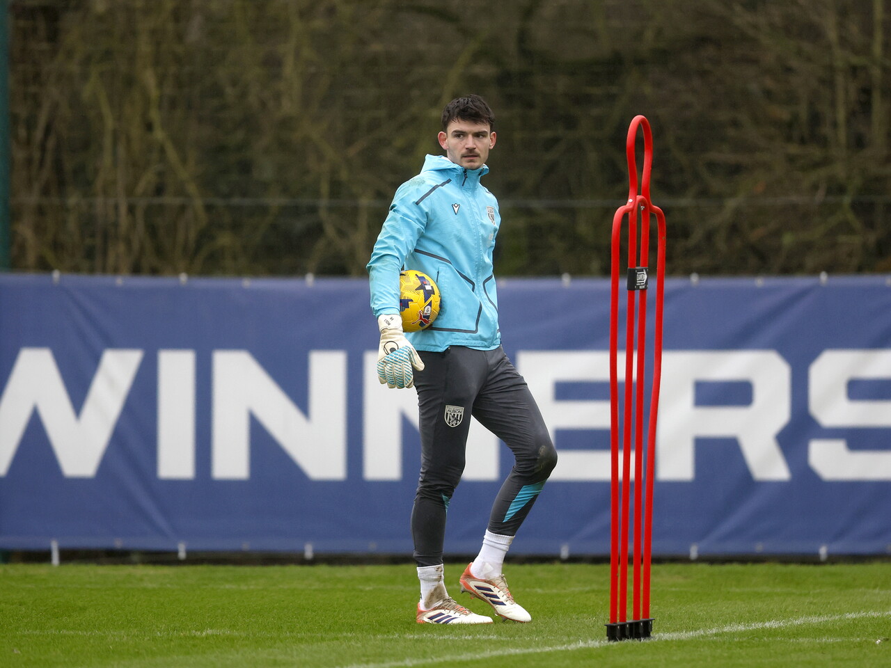 Max O'Leary holding the ball in training