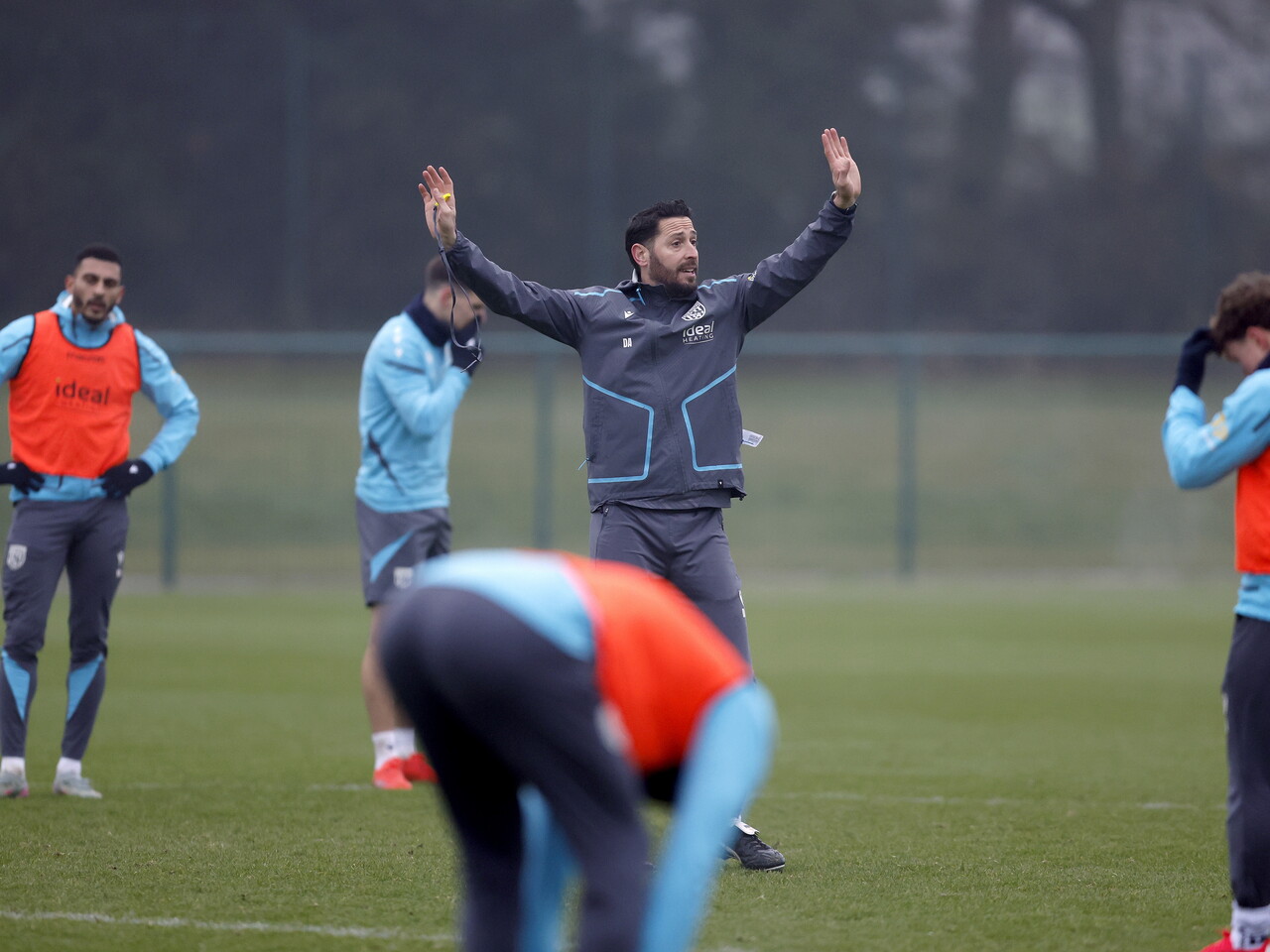 Damia Abella delivering instructions to players during a training session
