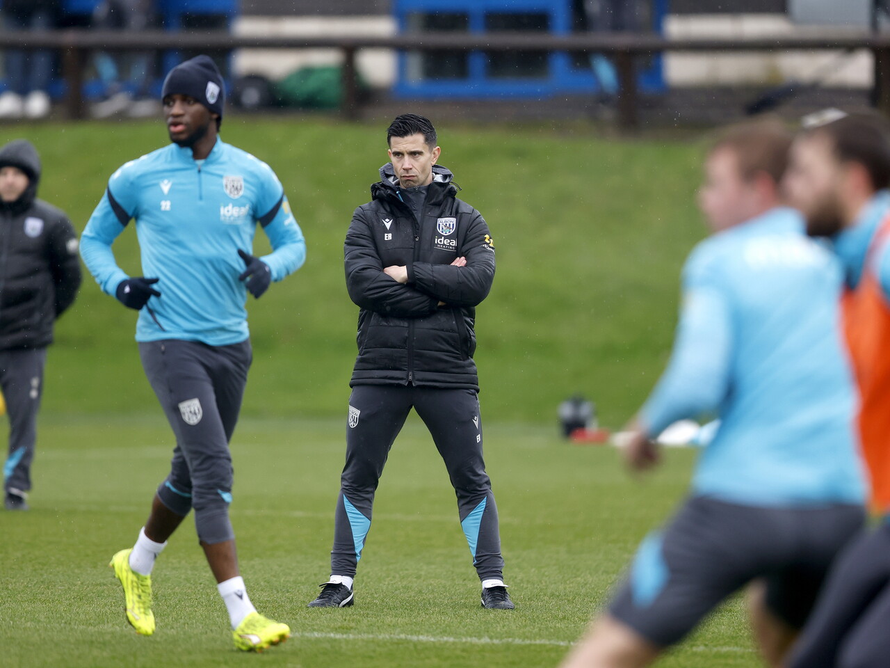 Eric Ramsay watching training in the rain