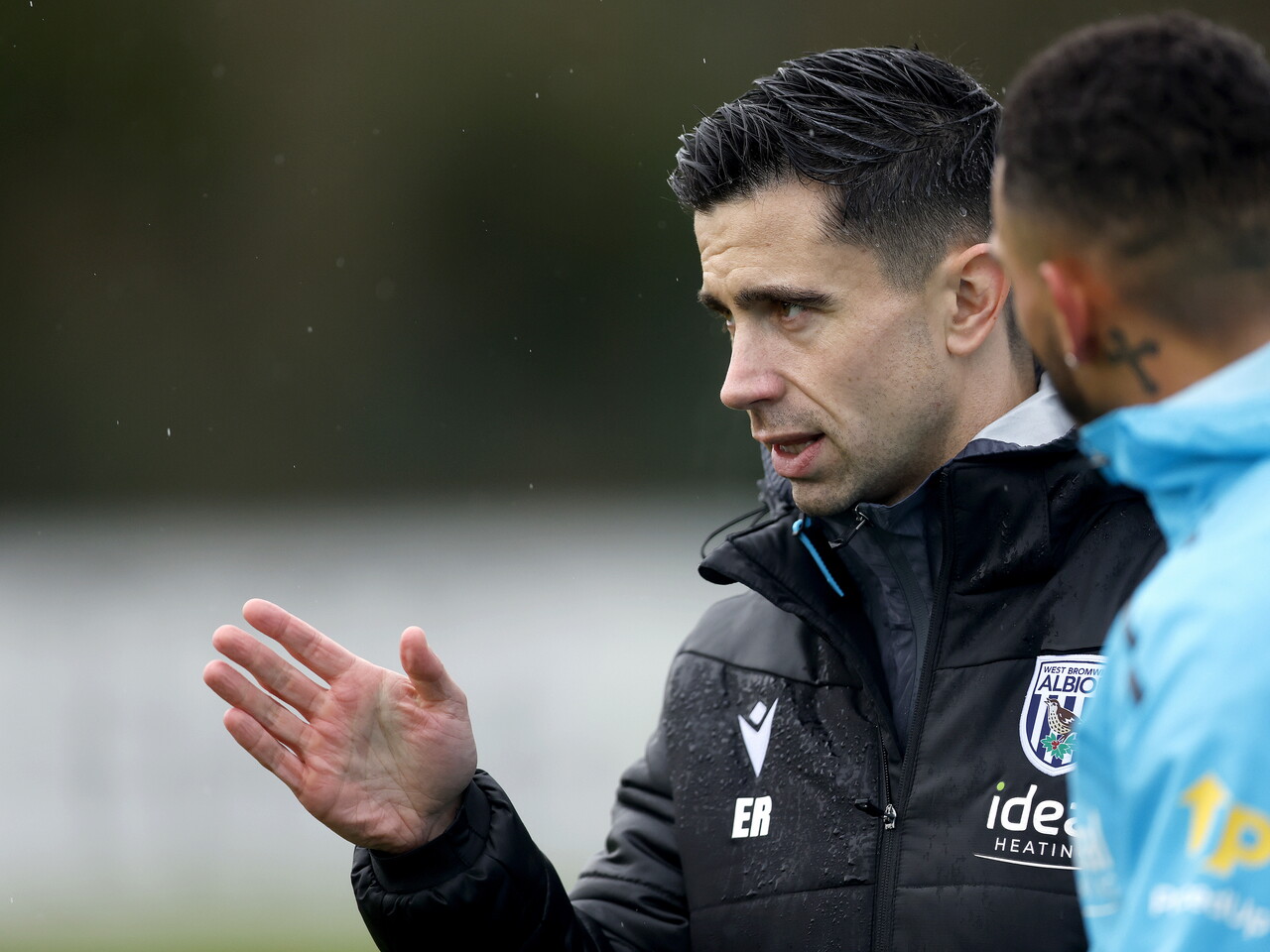 Eric Ramsay watching training in the rain