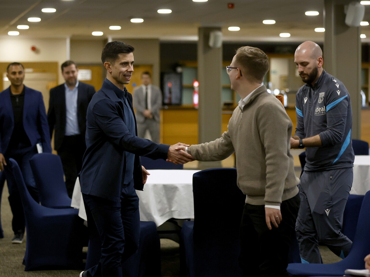 Eric Ramsay speaking to a local journalist