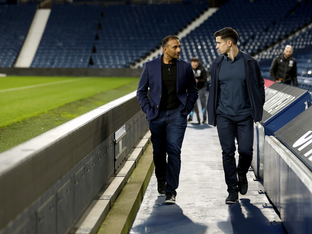 Shilen Patel and Eric Ramsay talking while walking around The Hawthorns