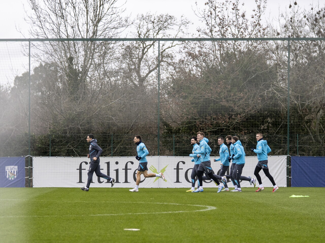 Several players running forward during a training session