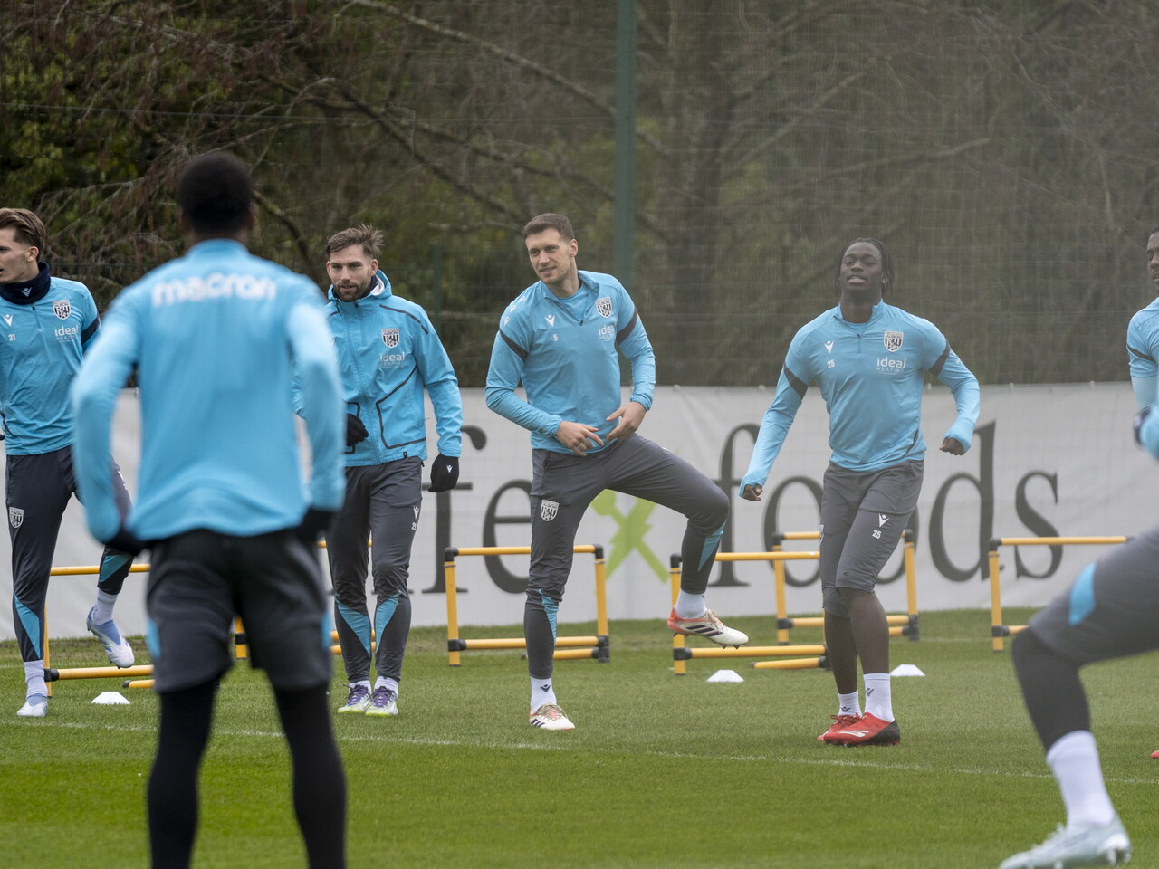 Several players warming up for a training session