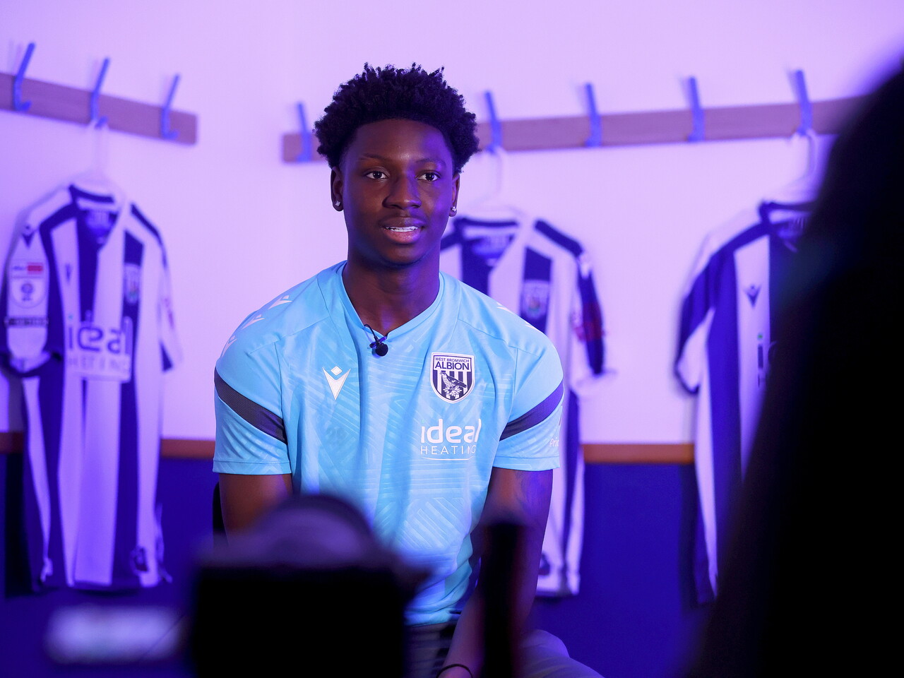 Jamaldeen Jimoh-Aloba being interviewed in a dressing room by WBA TV