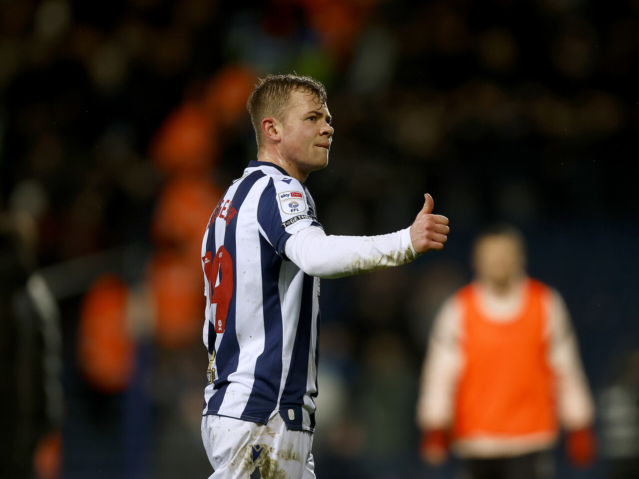 Aune Heggebø with his thumb up towards WBA fans