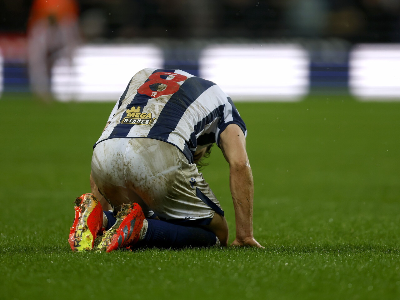 Jayson Molumby on the floor against Stoke