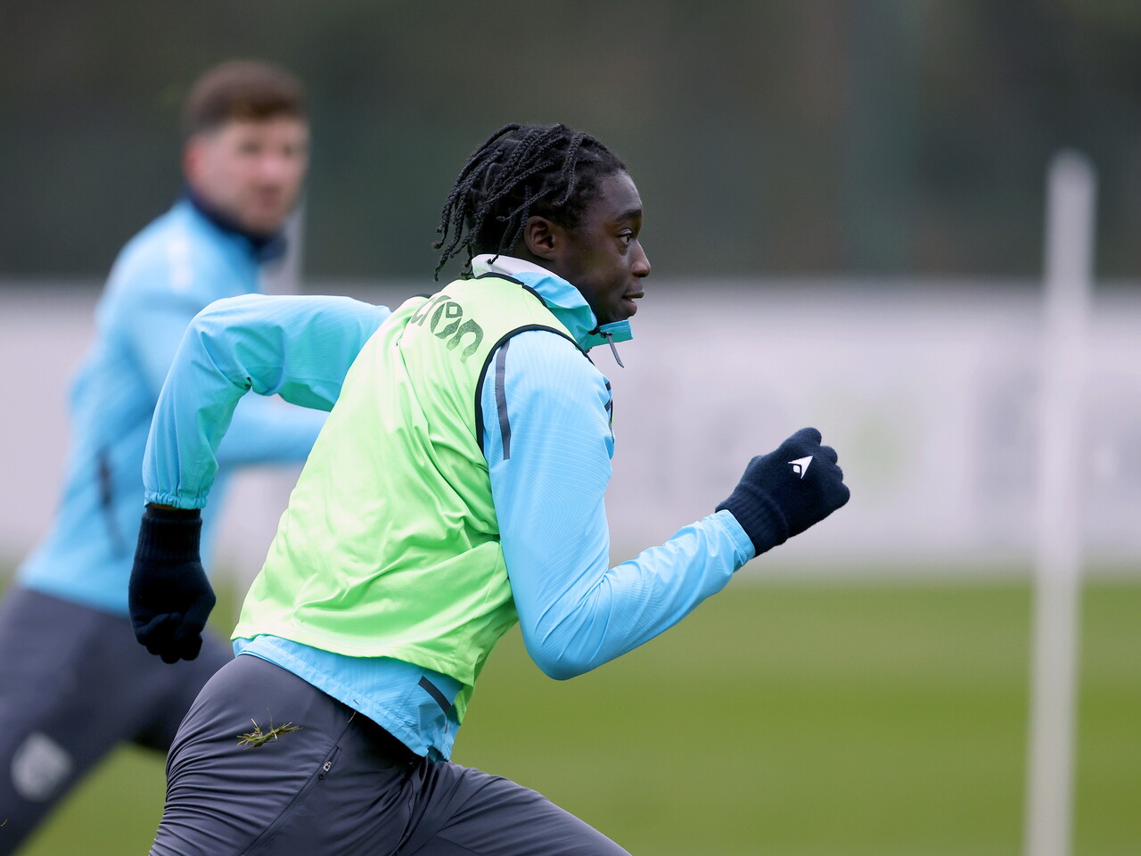 Hindolo Mustapha in training in a green bib