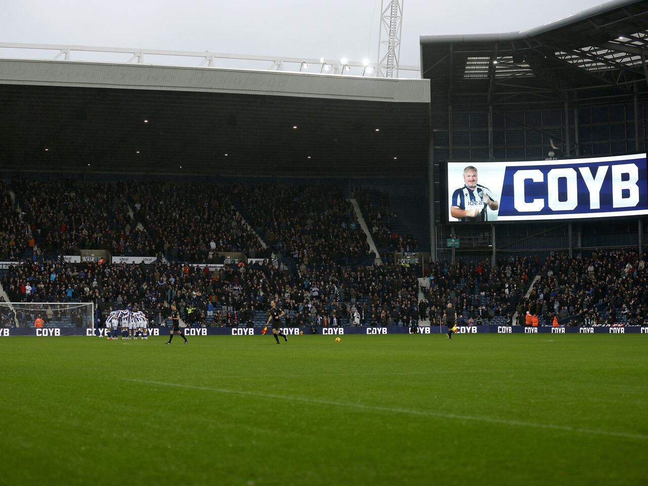 A general view of The Hawthorns moments before kick off against Stoke with the WBA team in a huddle