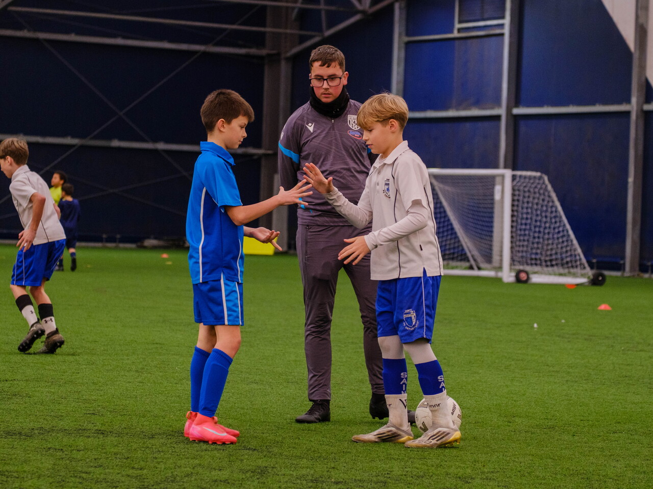 USW student oversee participants playing Rock, Paper, Scissors for kick-off