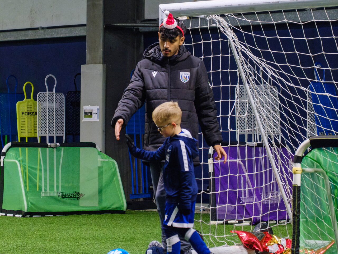 USW student at PDC Christmas event in WBA Academy Dome