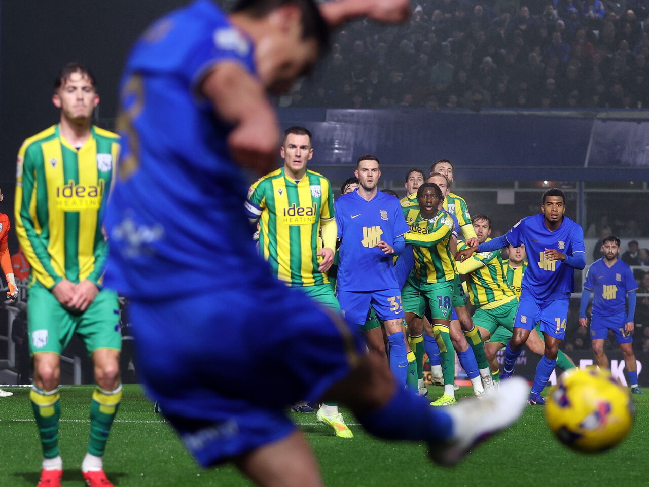 A blues player whips in a free-kick with plenty of Blues and WBA watching on