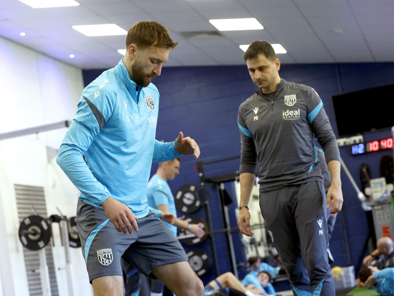 Nat Phillips stretching in the gym