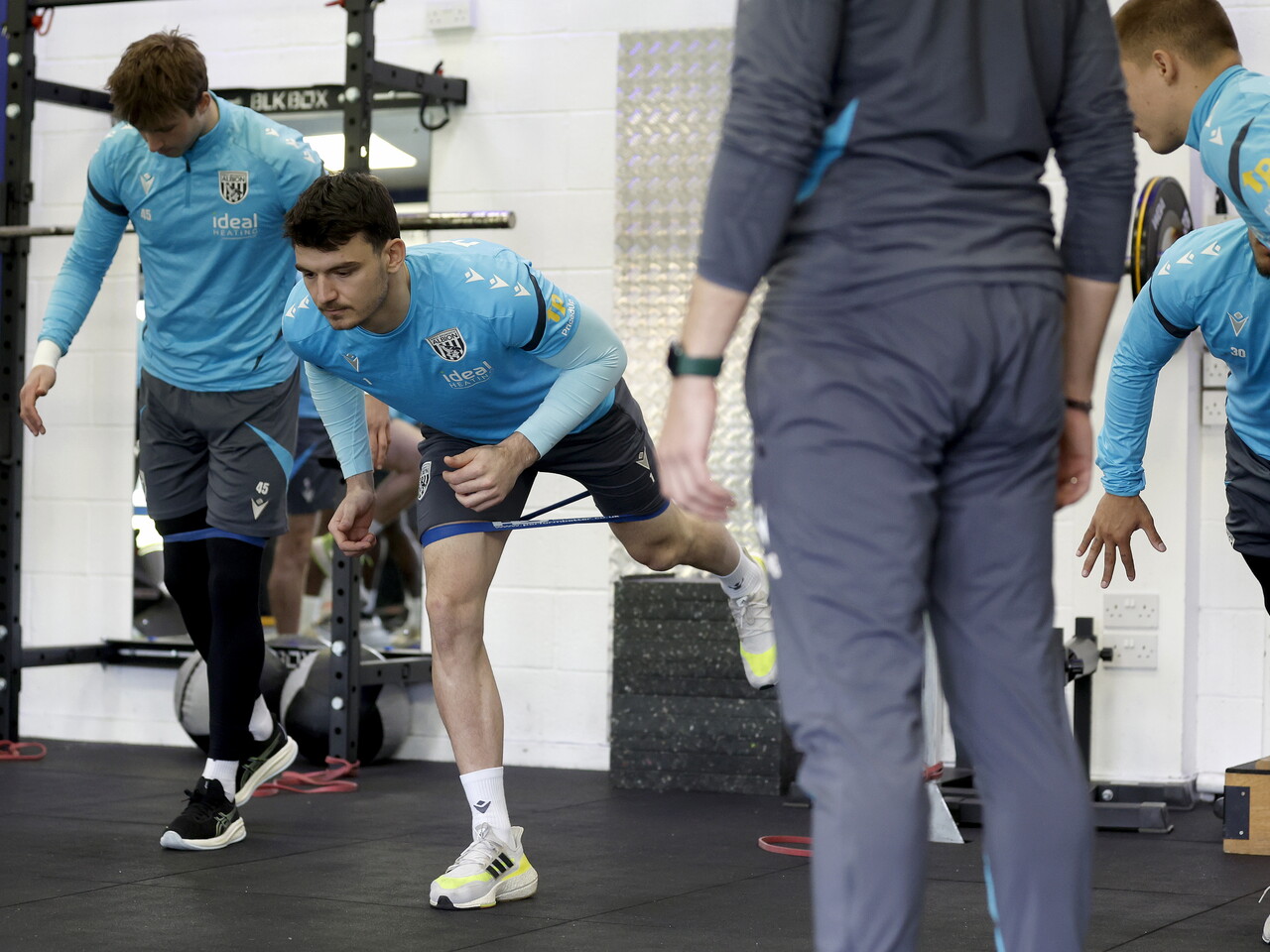Max O'Leary stretching in the gym