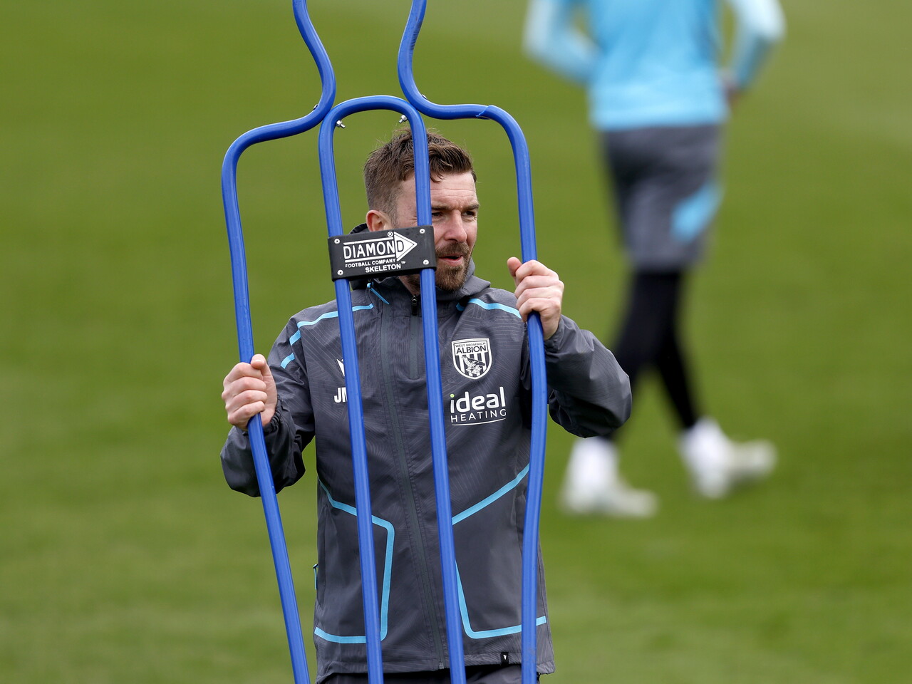 James Morrison carrying training equipment 