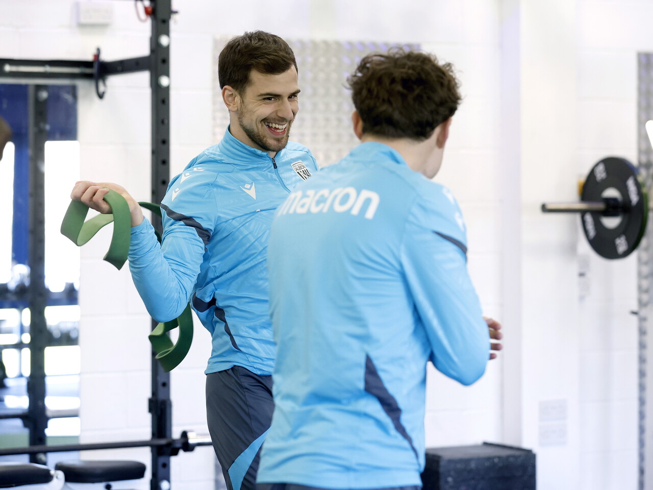 Jayson Molumby laughing with Callum Styles in the gym