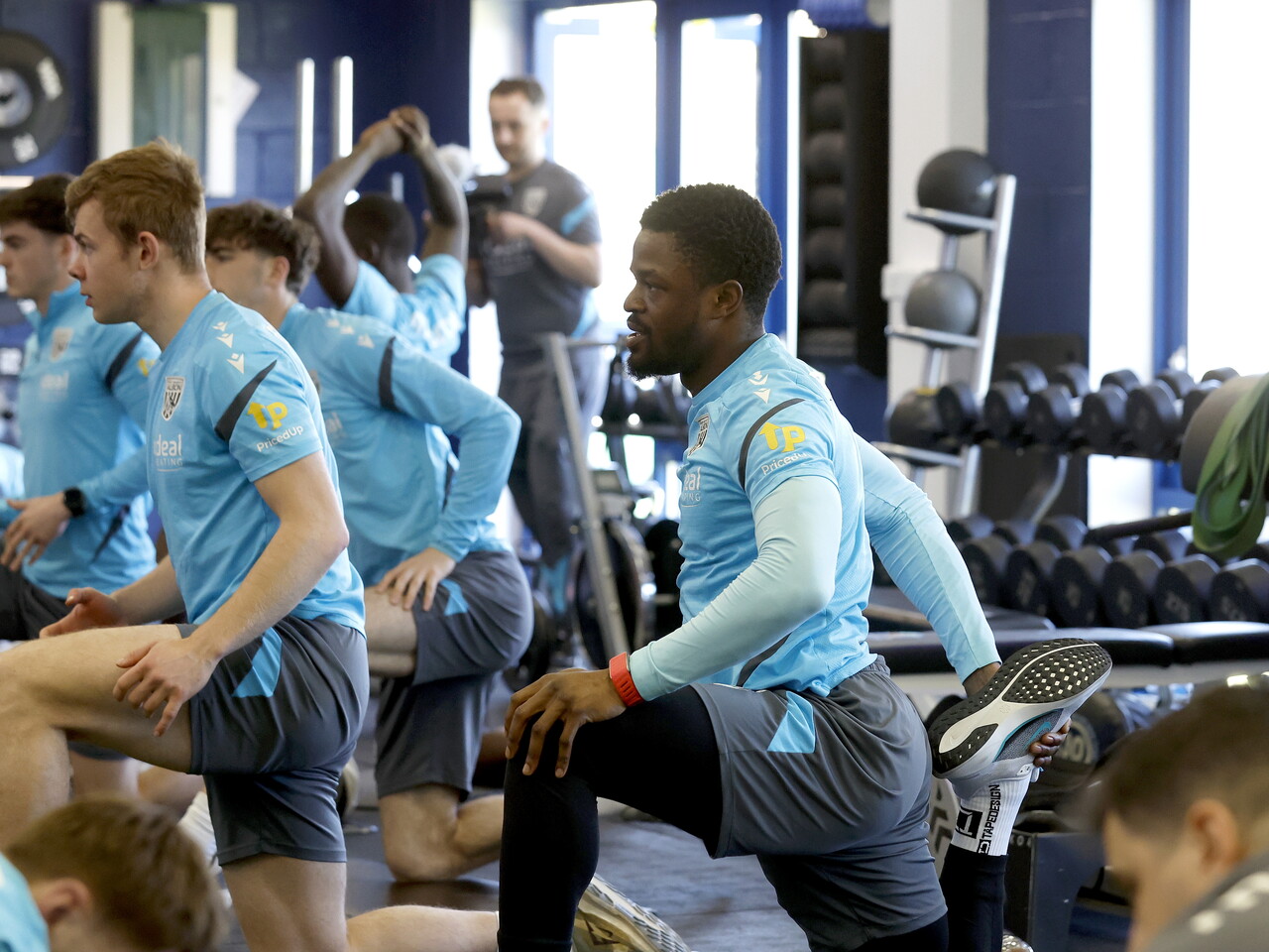 Josh Maja stretching in the gym