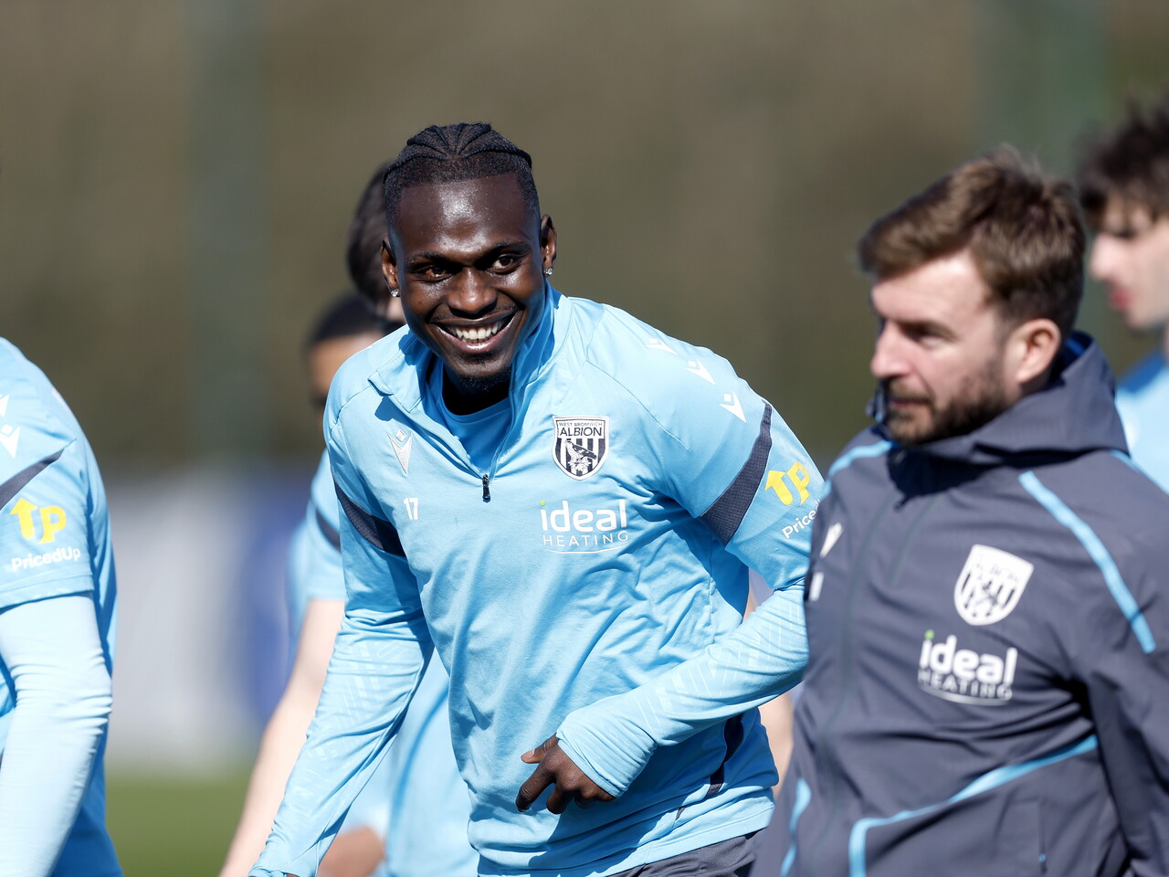 Ousmane Diakité smiling during a training session