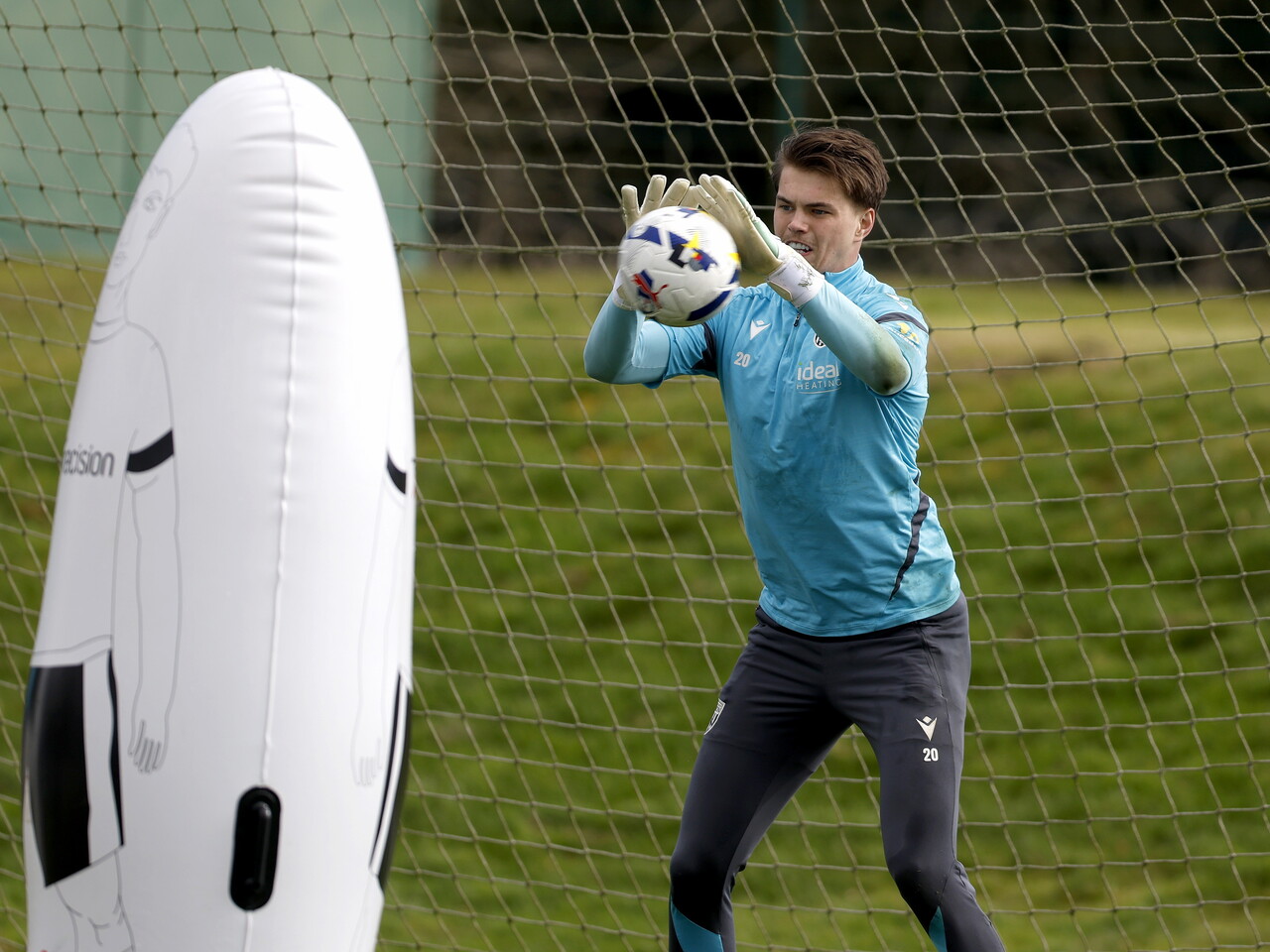 Josh Griffiths catching the ball during training 