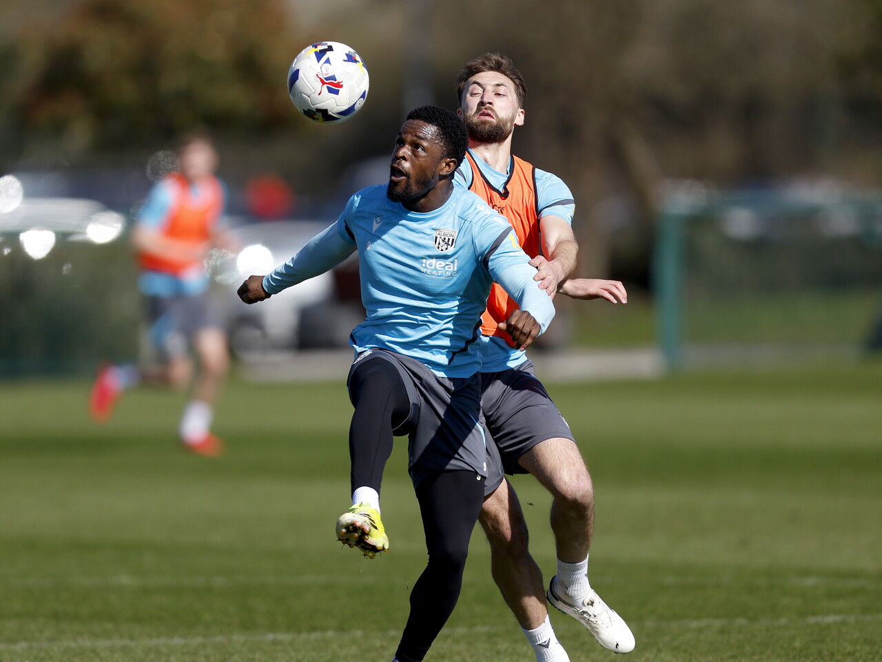 Josh Maja and Nat Phillips battling for the ball during a training session