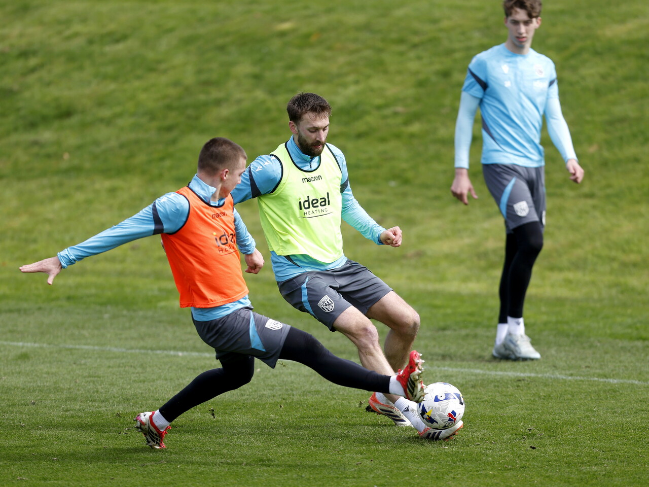 Nat Phillips and Alfie Gilchrist battling for the ball during training 