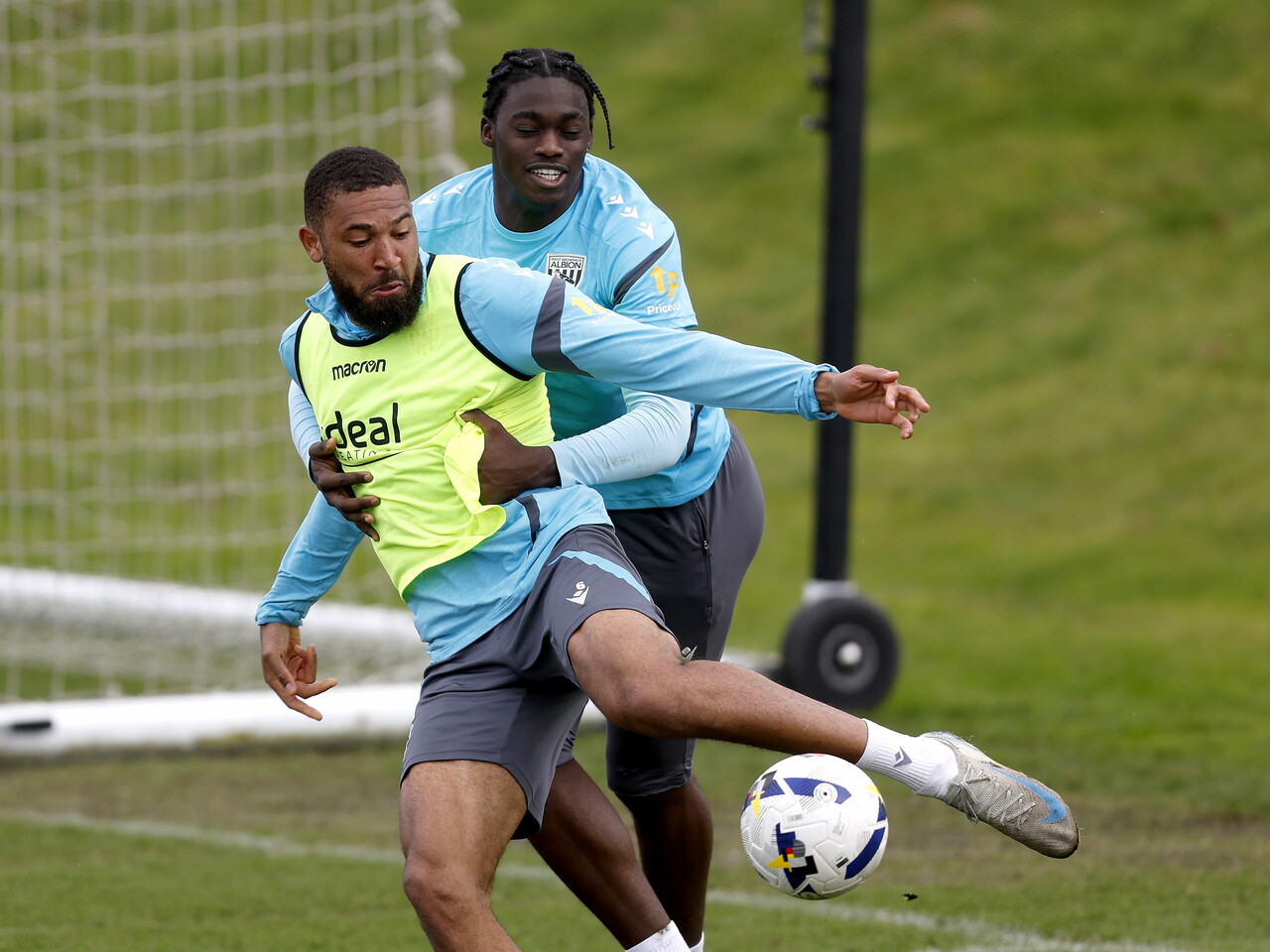George Campbell and Hindolo Mustapha battling for the ball during training 