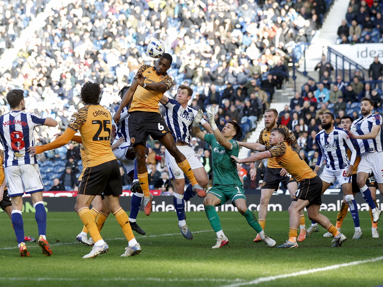 Several WBA & Hull players jumping to try and win an aerial ball in a penalty area